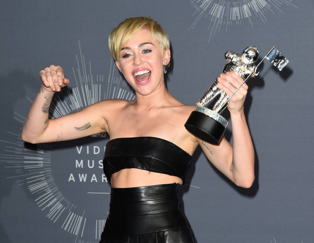 INGLEWOOD, CA - AUGUST 24: Recording Artist Miley Cyrus, winner of Video of the Year award for 'Wrecking Ball', poses in the press room during the 2014 MTV Video Music Awards at The Forum on August 24, 2014 in Inglewood, California. (Photo by Frazer Harrison/Getty Images)