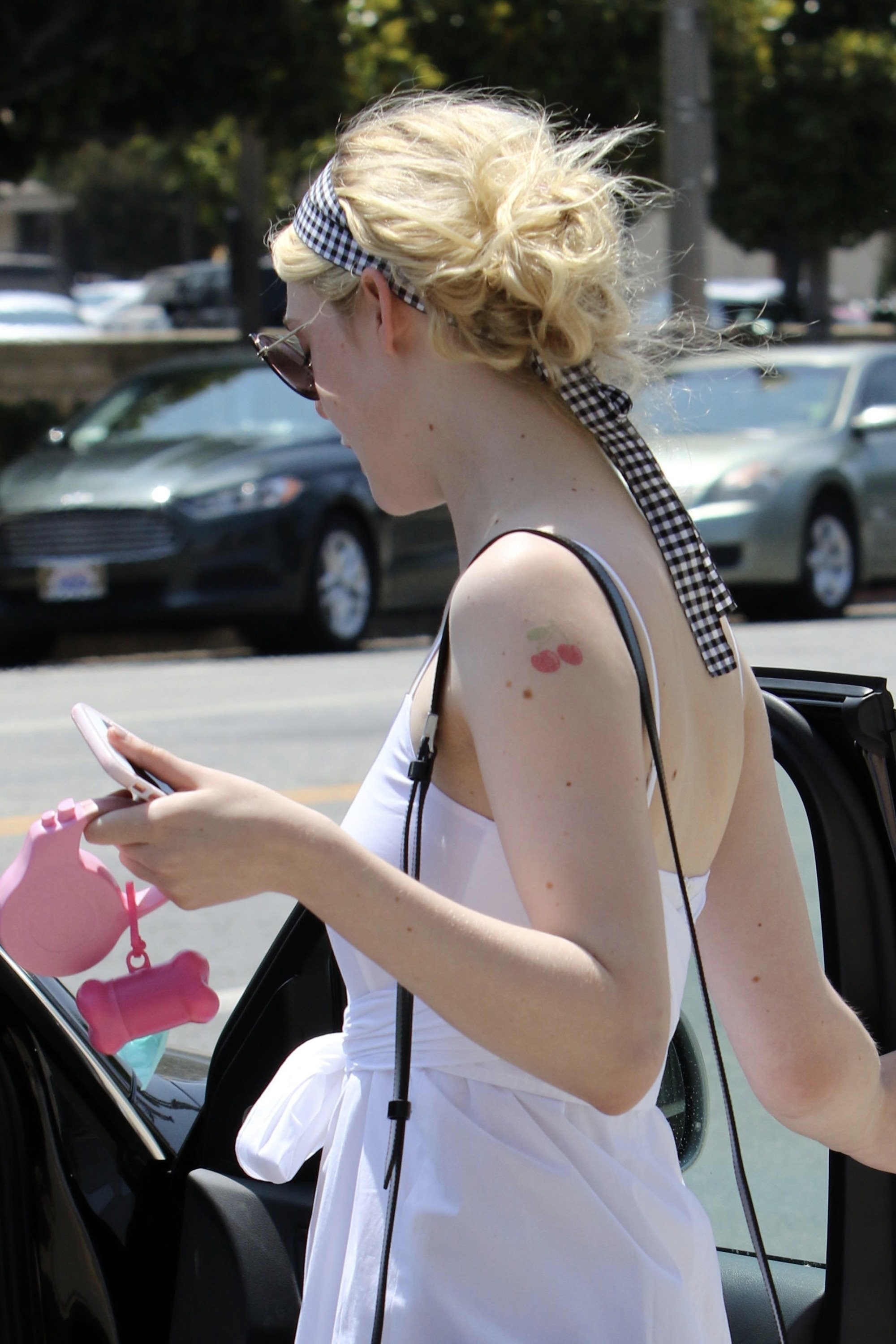 Elle Fanning street style fake tattoo