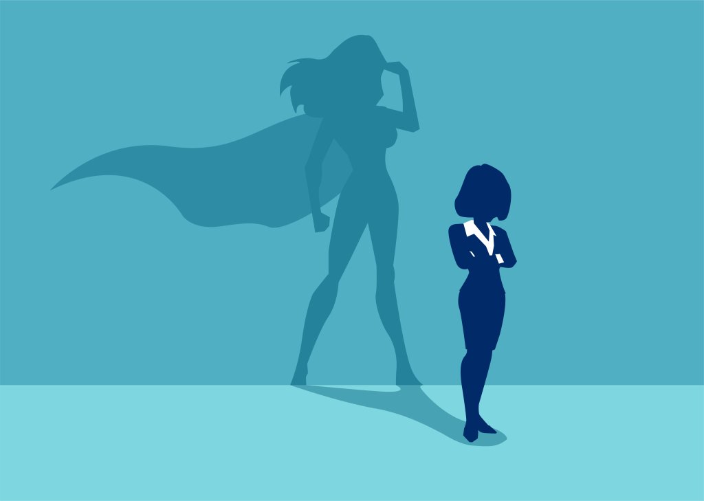 A ilustra de uma mulher vestindo um terninho e atrás dela a sombra de uma heroína
