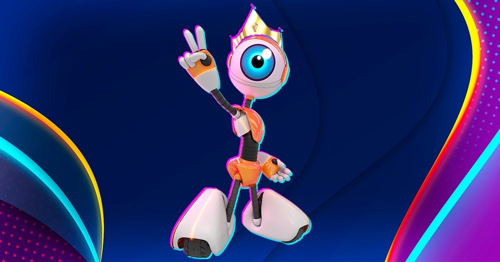 Imagem com um robô laranja do BBB22 usando a coroa de líder posando com dois dedos levantados (indicador e do meio) posando em um fundo azul escuro com detalhes em azul claro, vermelho e laranja