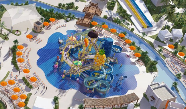 Detalhe do parque aquático da Nickelodeon. A foto aérea mostra várias piscinas, sendo uma redonda. No centro dela, um toboágua inspirado no Bob Esponja, com a casa abacaxi no centro