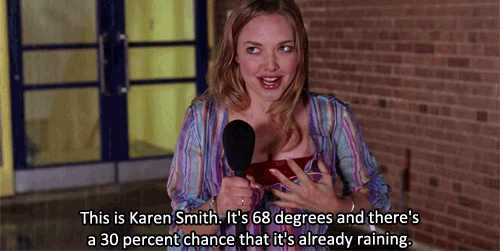 Gif of Karen Smith in the rain with a microphone.