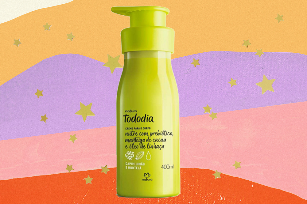 produto-skincare-cada-signo-touro-creme-hidratante Creme hidratante corporal em fundo amarelo, lilás, rosa e laranja com estrelinhas douradas