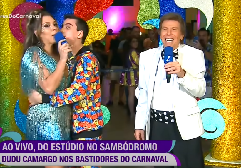 Dudu Camargo agarra sem consentimento e tenta "roubar"um selinho de Simony durante entrevista