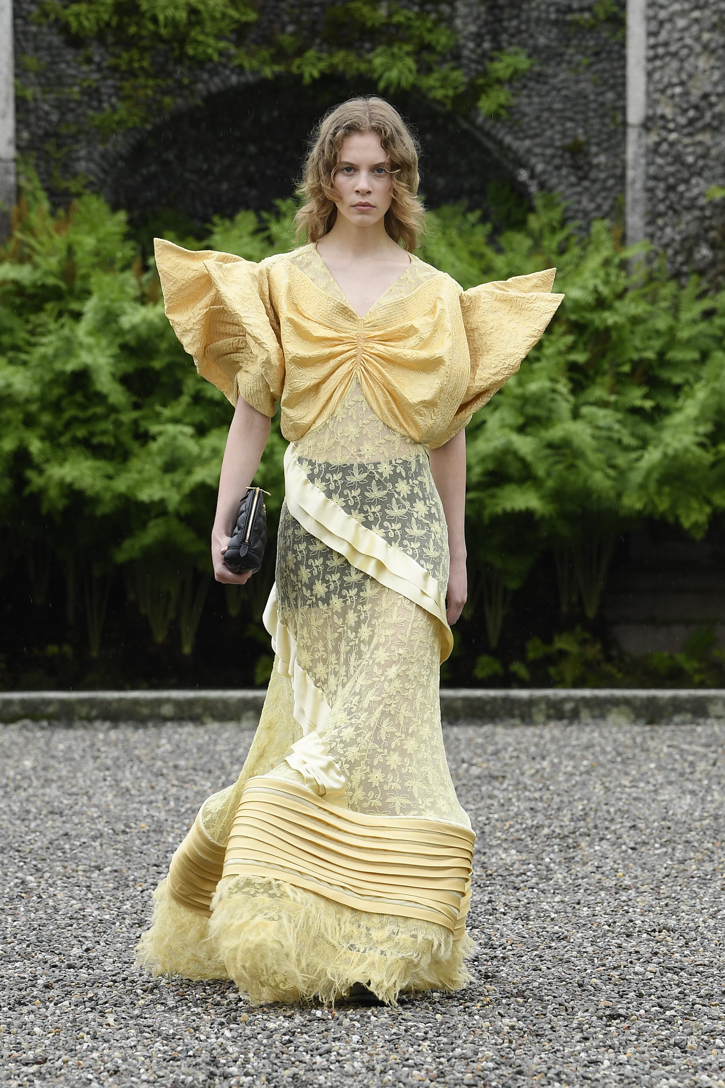 Model on the runway at Louis Vuitton Cruise 2024 Collection Fashion Show on the Italian island of Isola Bella on May 24, 2023 on Lake Maggiore, Italy.