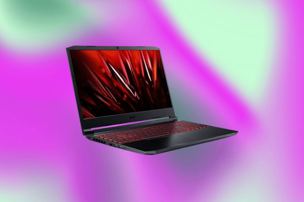 Imagem de um laptop cinza escuro em um fundo roxo e verde claro
