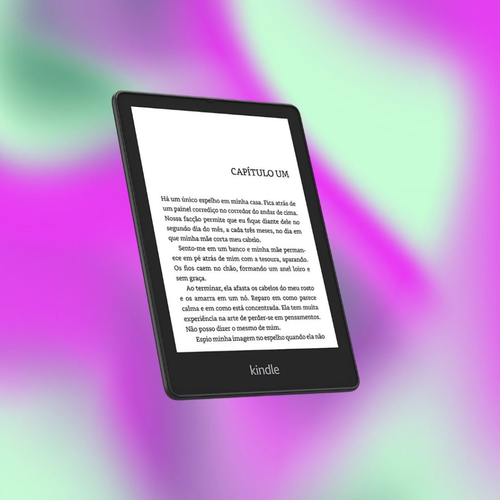 Imagem de um Kindle com a tela acesa; o fundo é uma textura nas cores verde e lilás